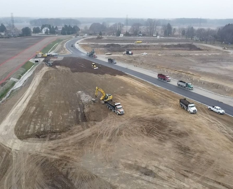 large excavators and construction equipment on Sherway surfacing site
